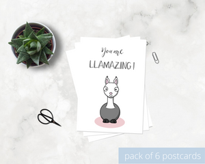 Poppleberry A6 positivity postcard, with a white & grey smiling llama illustration and uplifting message, on white cardstock.