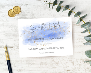 A watercolour blue A6 Poppleberry one-sided wedding save the date card, with gold sparkles.
