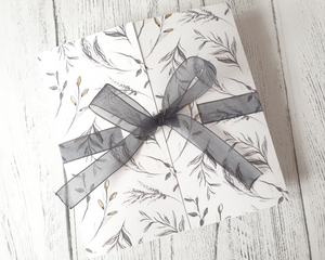 Charcoal wildflower sketch Poppleberry gate-fold wedding invitation set, wrapped with black organza ribbon while folded
