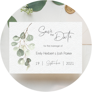 Muted green eucalyptus Poppleberry A6 wedding save the date card, with eucalyptus leaves in background.