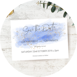 A watercolour blue A6 Poppleberry one-sided wedding save the date card, with gold sparkles.