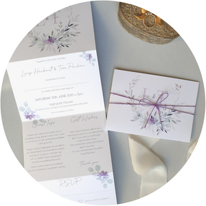 Violet & lilac A6 Poppleberry accordion fold all-in-one wedding invitation, folded and wrapped in matching silk thread.