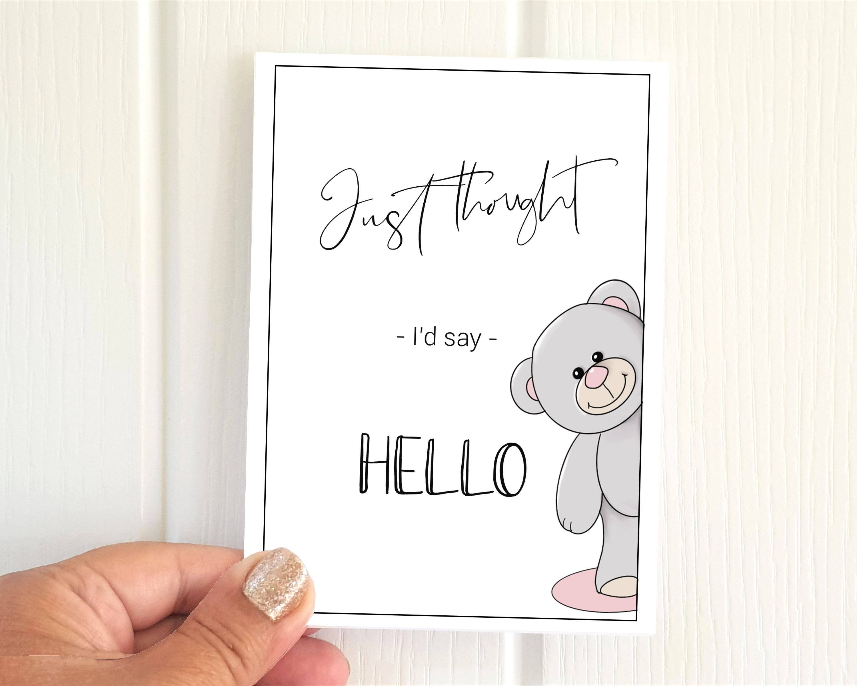 Grey bear illustration A6 'Just thought I'd say hello' pack of 6 Poppleberry positivity postcards, held to show size.