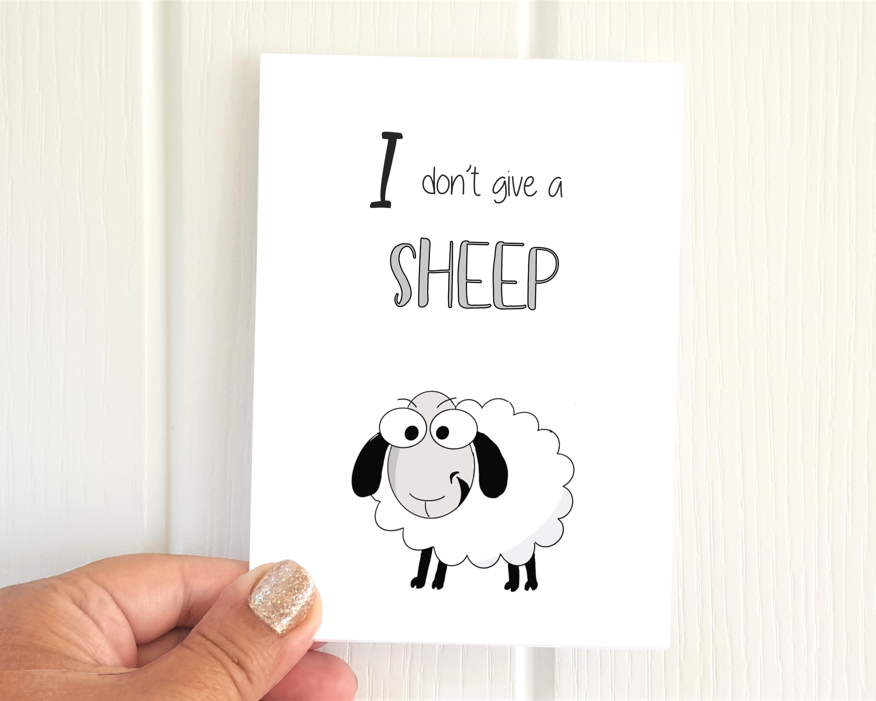 Cheeky sheep illustration A6 'I don't give a sheep!' pack of 6 Poppleberry funny rude animal postcards.