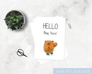Poppleberry A6 positivity postcard, with a waving brown bear illustration and uplifting message, on white cardstock.