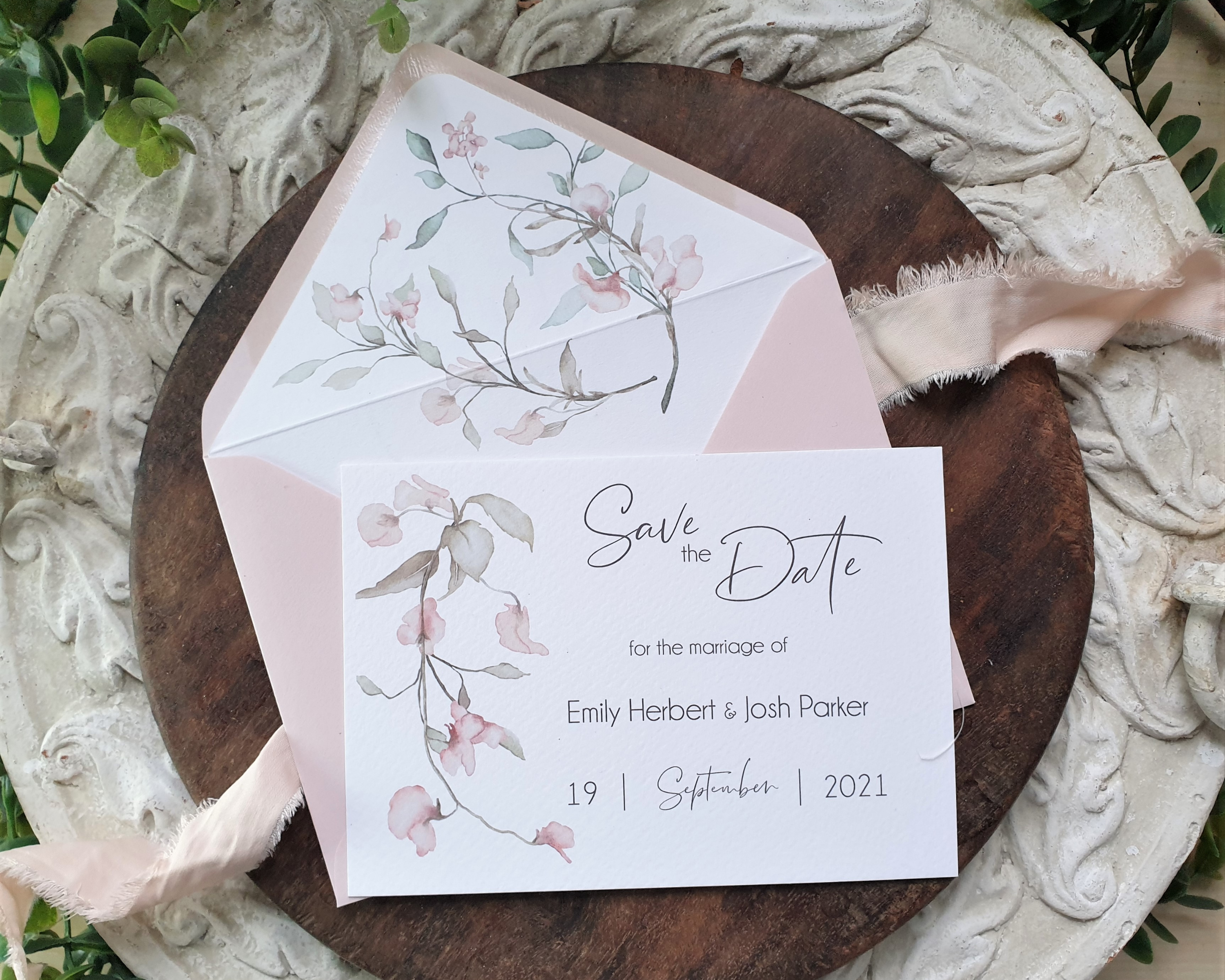 Watercolour pink floral design Poppleberry A6 wedding save the date card, with blush pink envelope with matching liner.