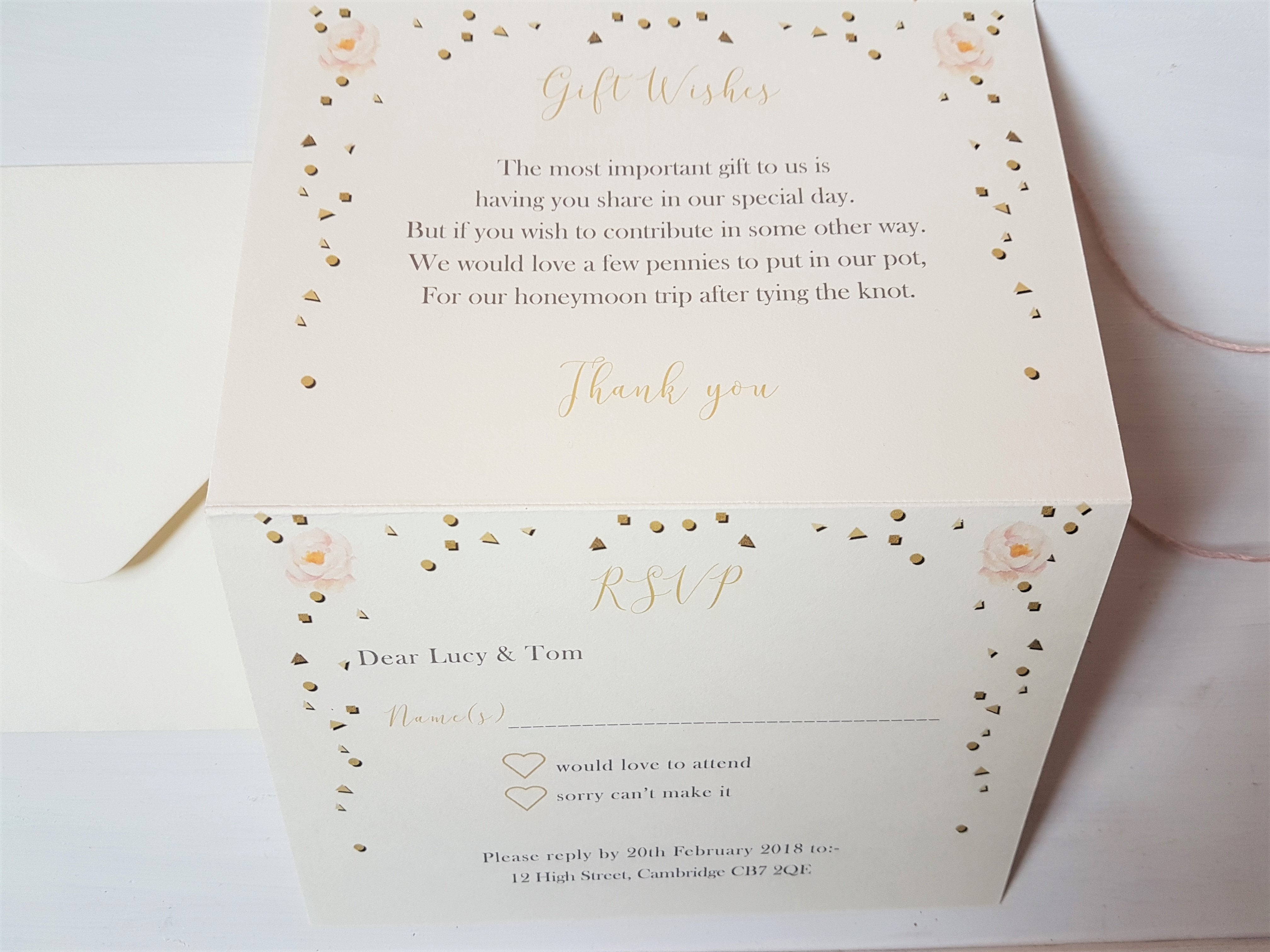 Close-up of the bottom half of an unfolded golden bunting A6 Poppleberry accordion fold all-in-one wedding invitation.
