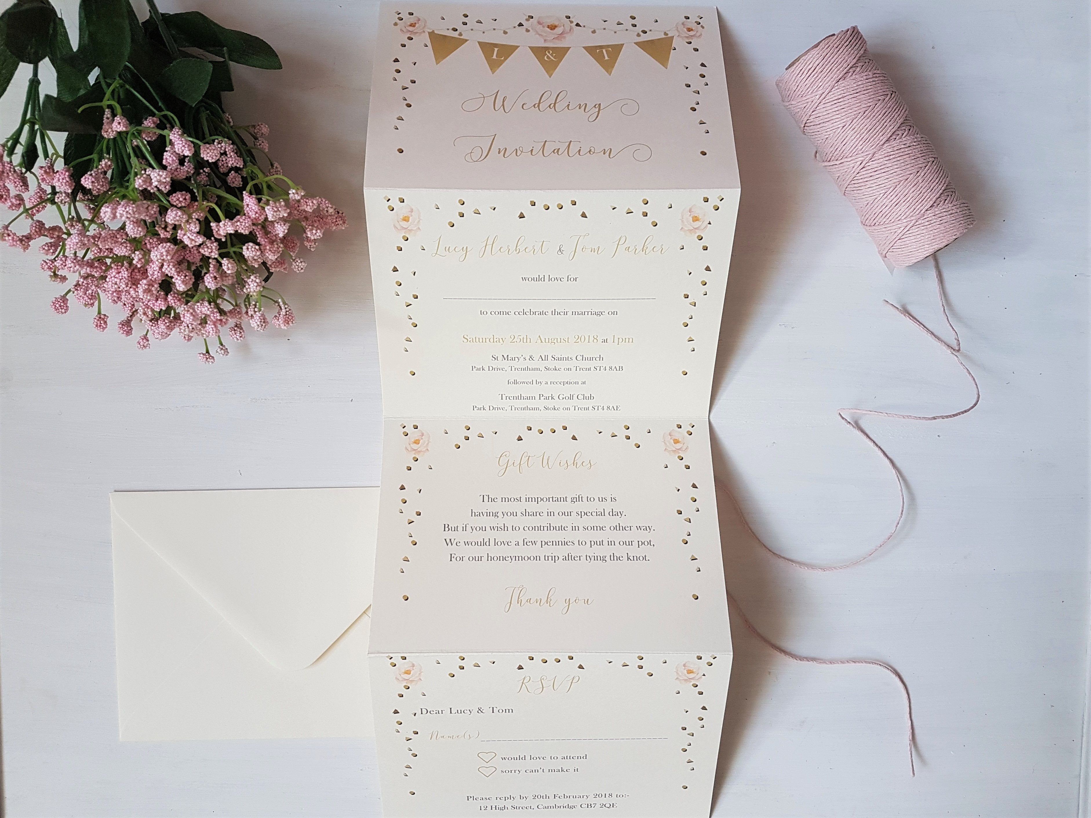 Golden bunting A6 Poppleberry accordion fold all-in-one wedding invitation, unfolded to show info, with cream envelope.