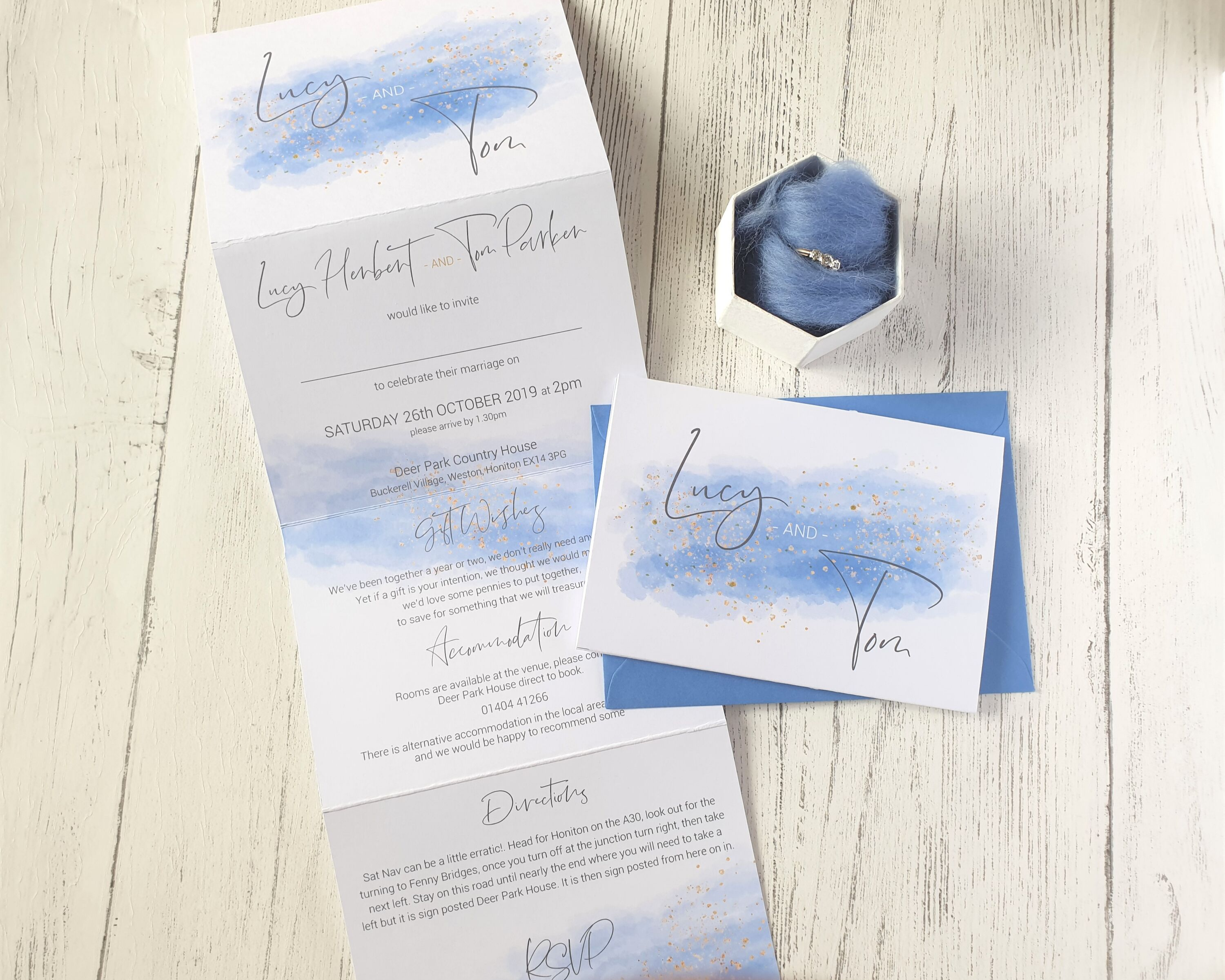 Watercolour blue splash A6 Poppleberry accordion fold all-in-one wedding invitation, folded & unfolded from its A6 size.