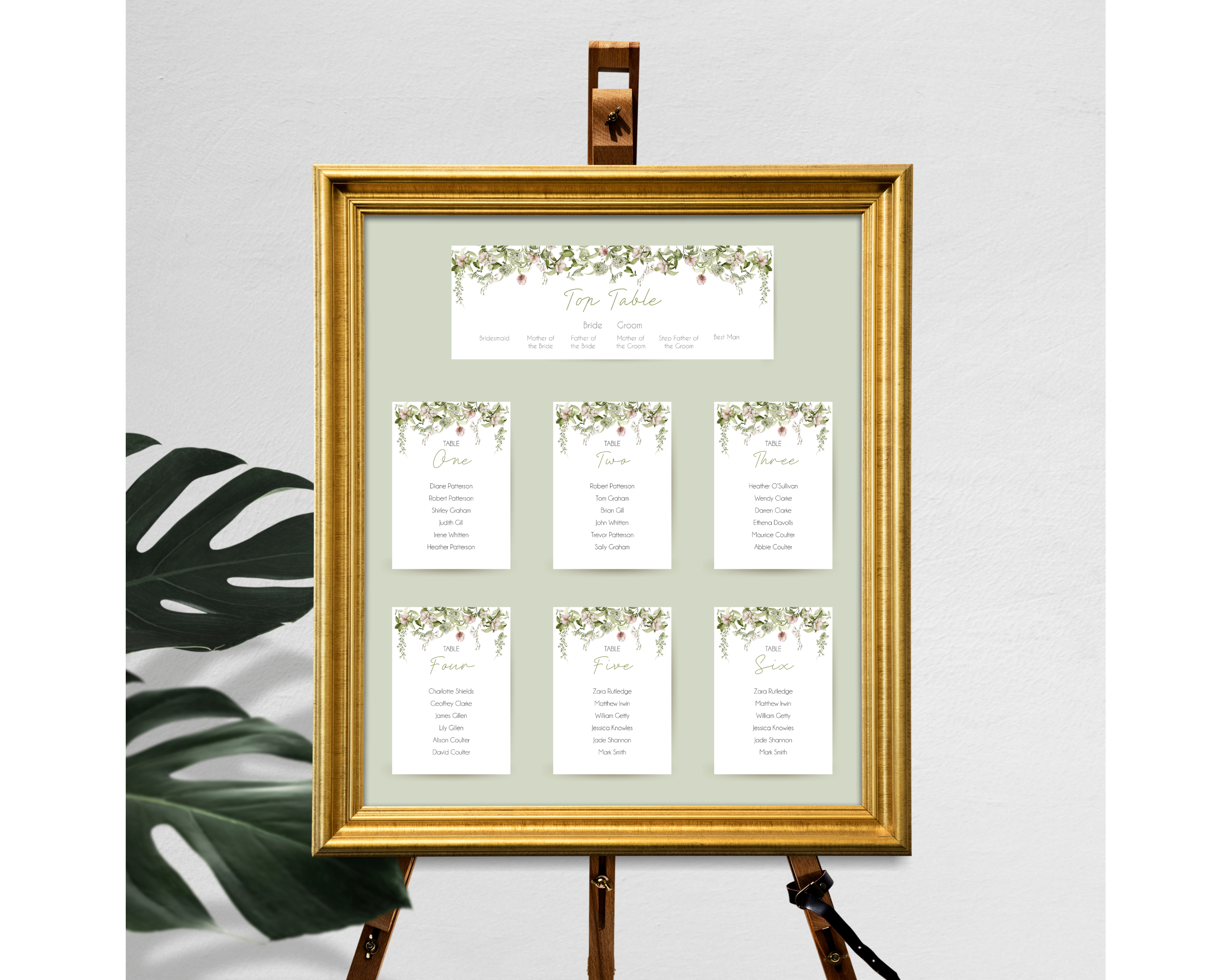 A set of Poppleberry blush & green floral wedding table plan cards, including 'top table' and 'A6 table' cards, framed.