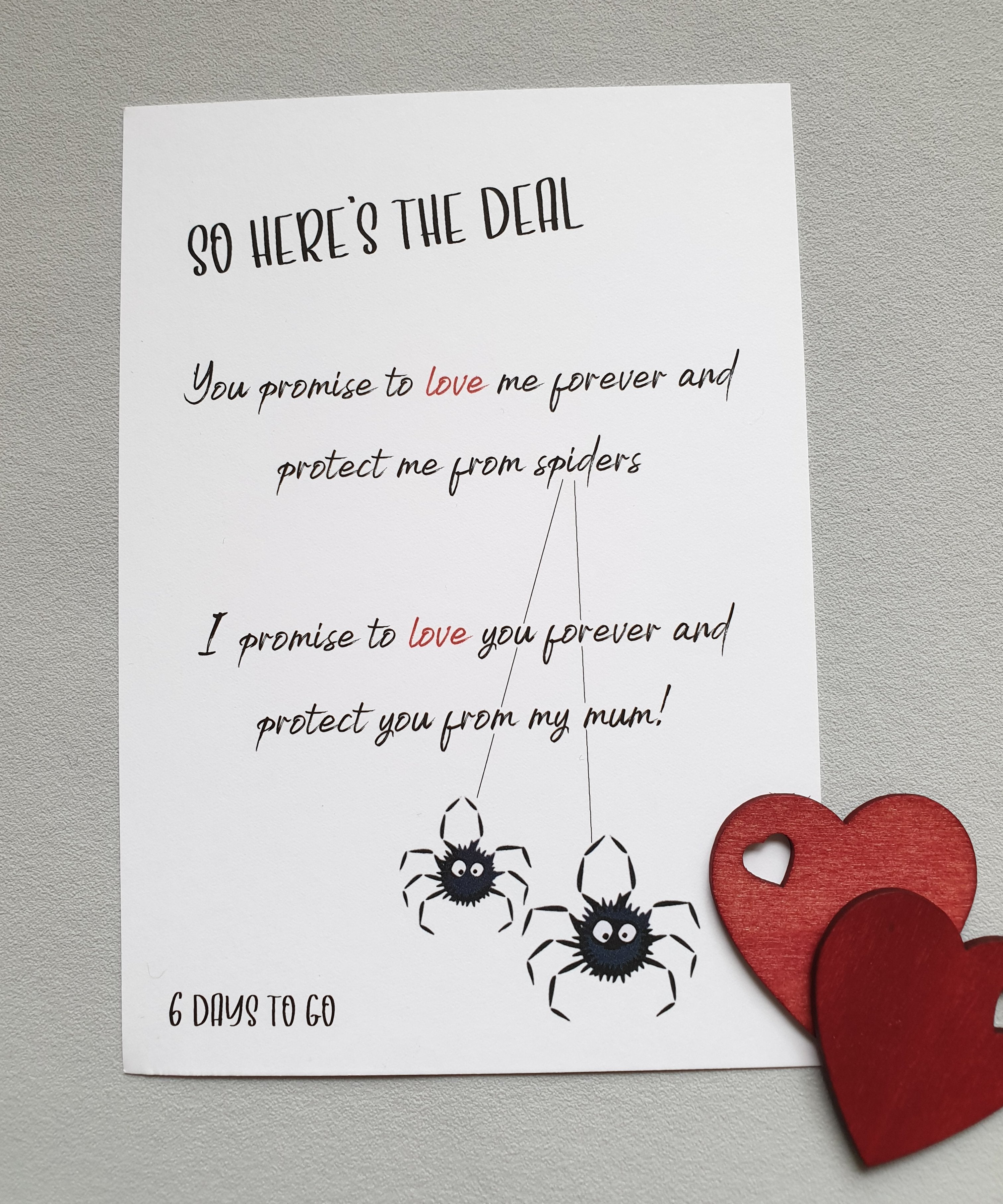 The '6 days to go' A6 Poppleberry wedding countdown postcard on white cardstock with 2 black spider illustrations.
