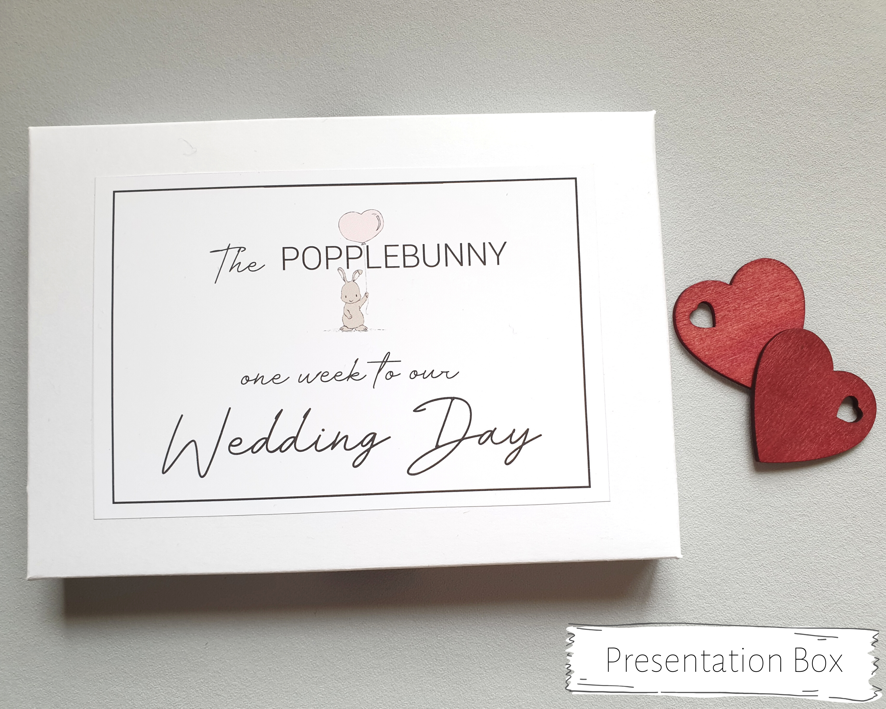 The white presentation box to keep the postcards safe with small bunny (the Popplebunny) illustration.