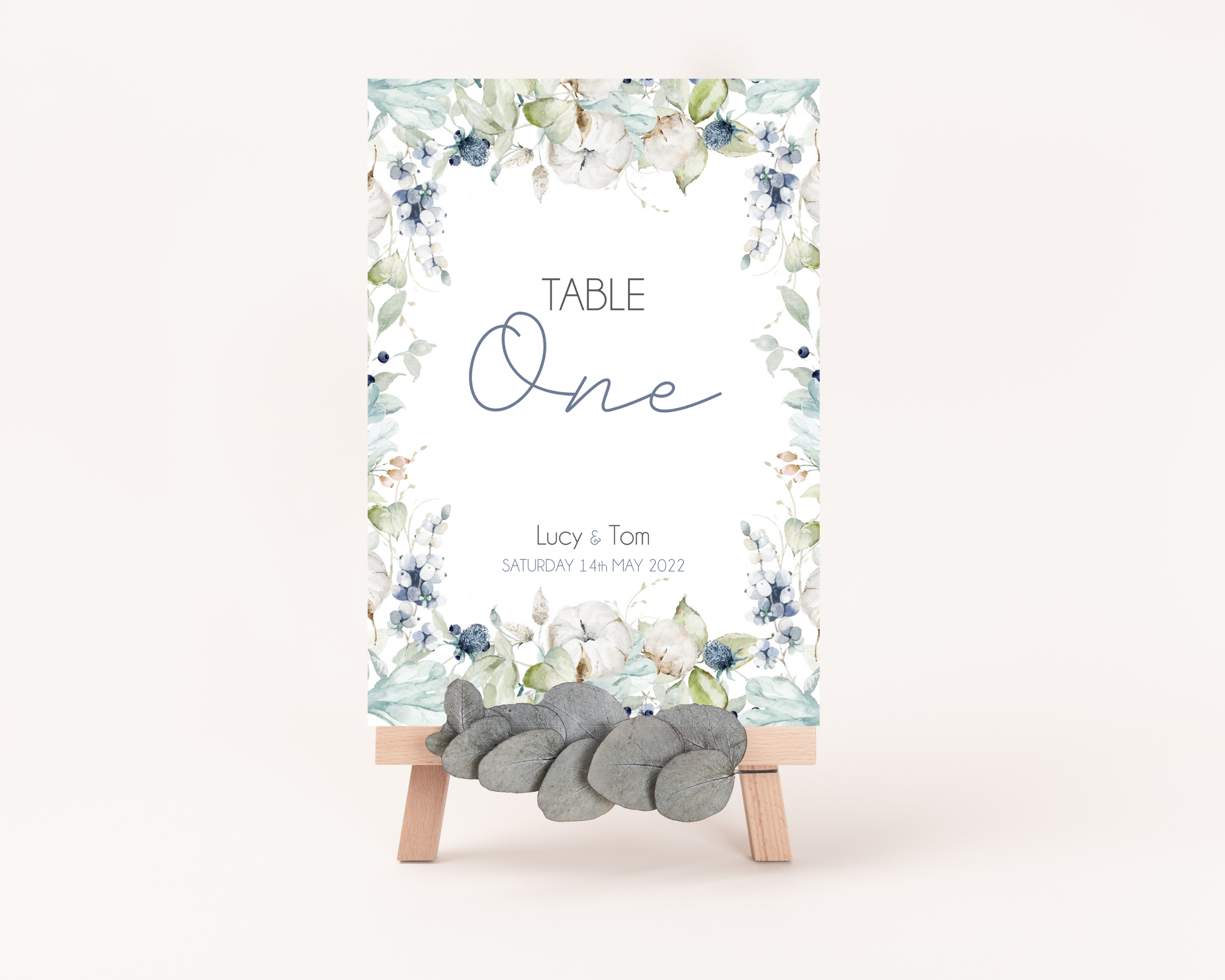 A Poppleberry dusty blue & cotton flowers wedding table number card, for 'Table One' of Lucy & Tom's wedding, in A6 size.