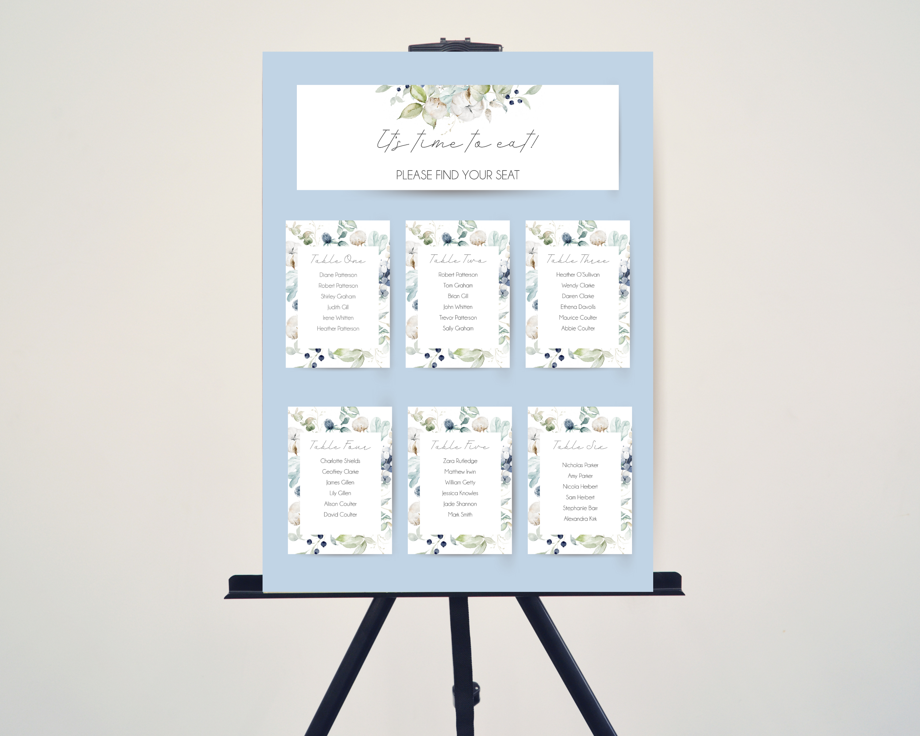 A set of Poppleberry dusty blue & cotton wedding table plan cards, including 'top table' and 'A6 table' cards, displayed on an easel.