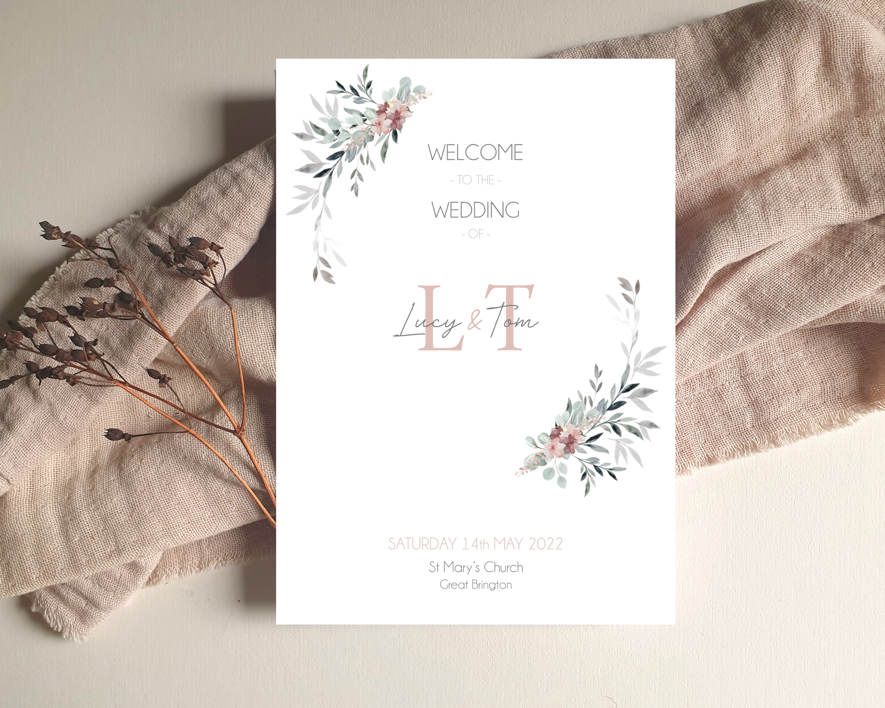 Front of a dusty pink & grey foliage A5 Poppleberry wedding order of service / order of the day card, on white cardstock.