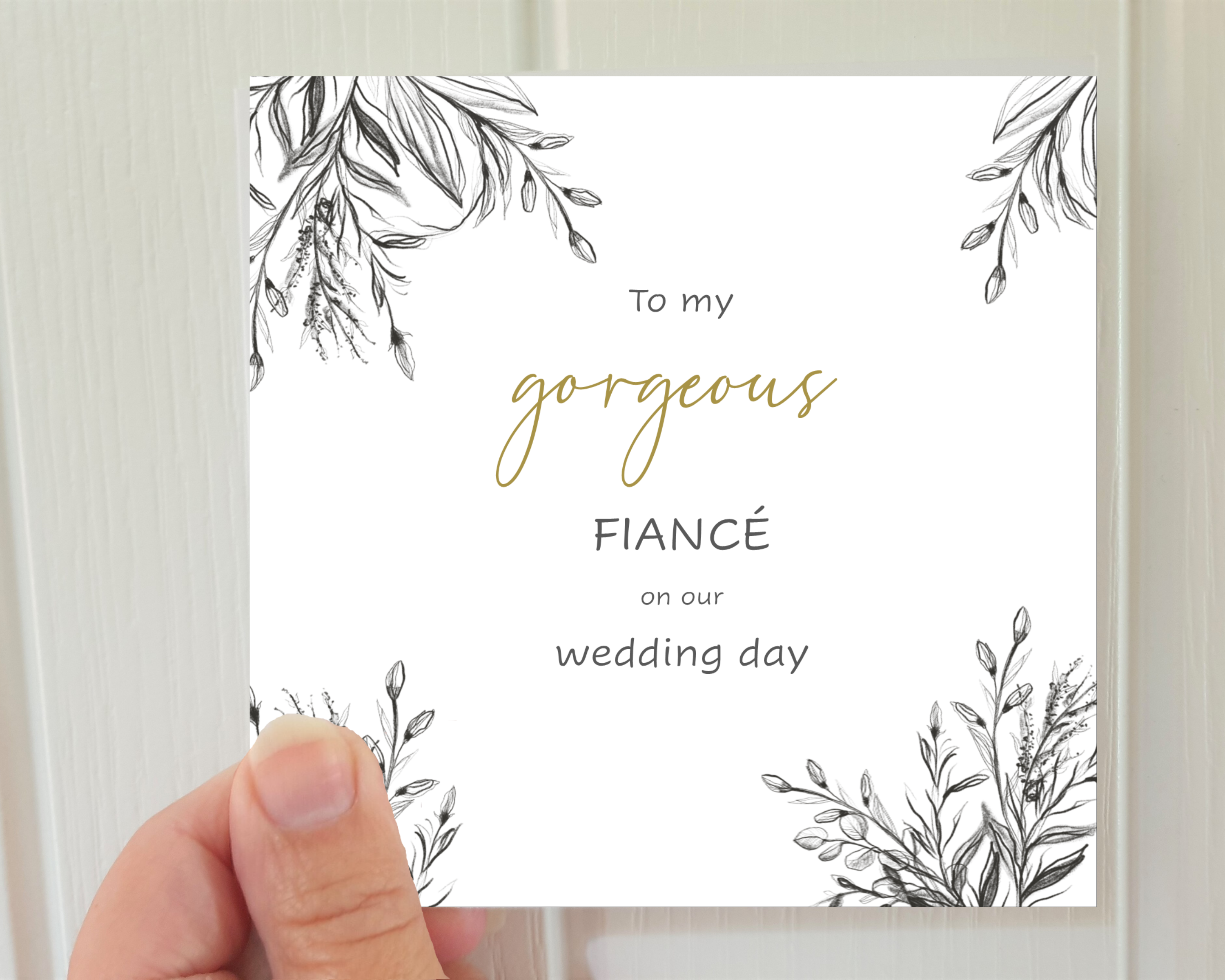 Front of a Poppleberry square luxury charcoal-design wedding day card, held to show size of square 5-inch card.