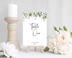Open image in slideshow, A Poppleberry greenery &amp; eucalyptus wedding table number card, for &#39;Table One&#39; of Lucy &amp; Tom&#39;s wedding, in A6 size.
