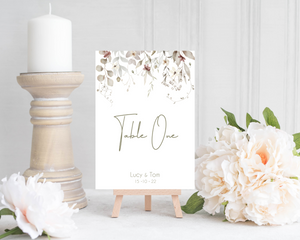 A Poppleberry neutral-shaded foliage wedding table number card, for 'Table One' of Lucy & Tom's wedding, in A5 size.