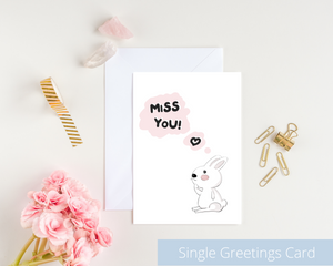 Poppleberry A6 folded greetings card, with a thinking white bunny illustration, on white cardstock and white envelope.